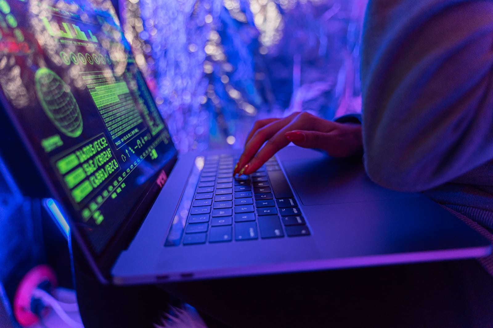 Small business owner reviewing a security dashboard on a laptop in an office