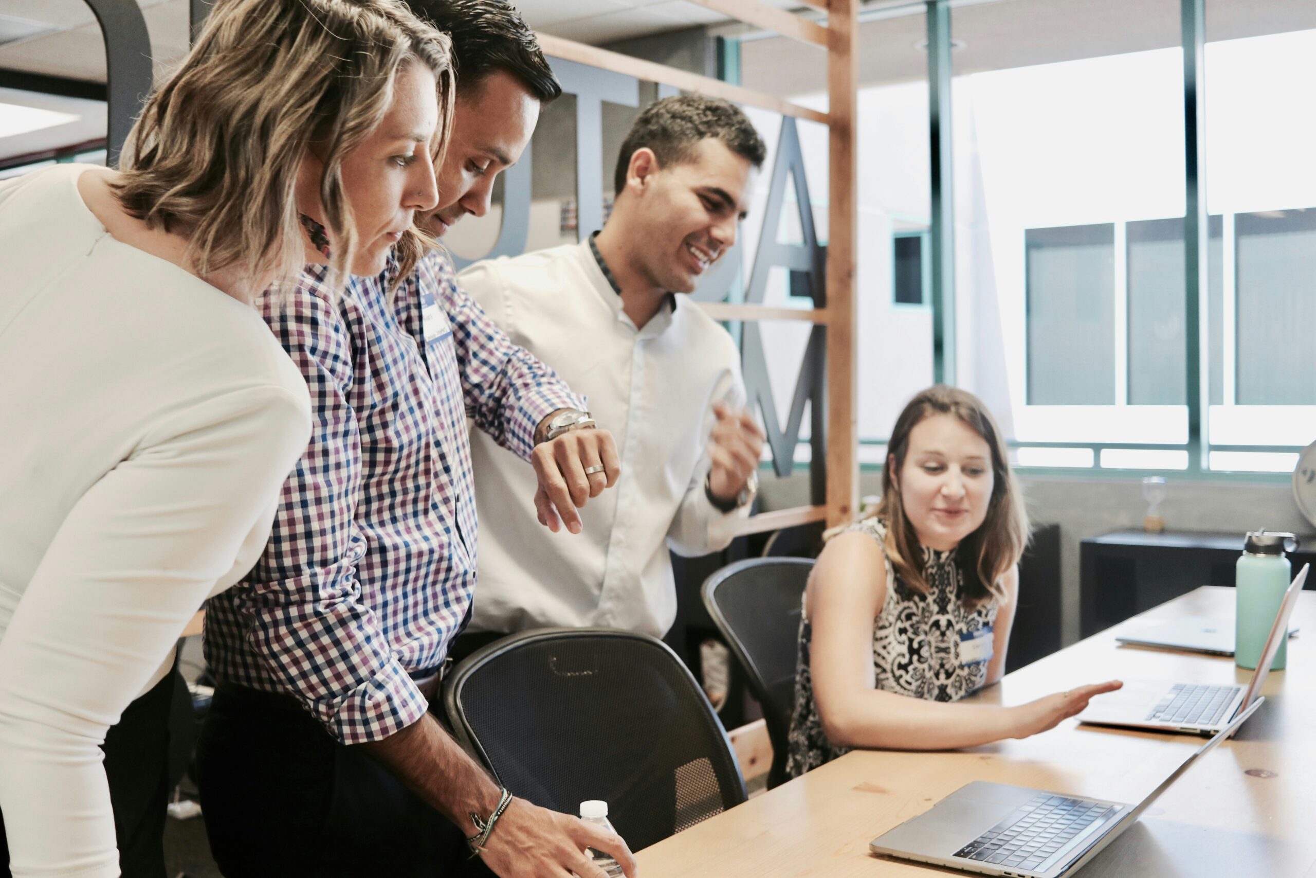 MSP technician helping a small business owner implement an AI workflow automation together